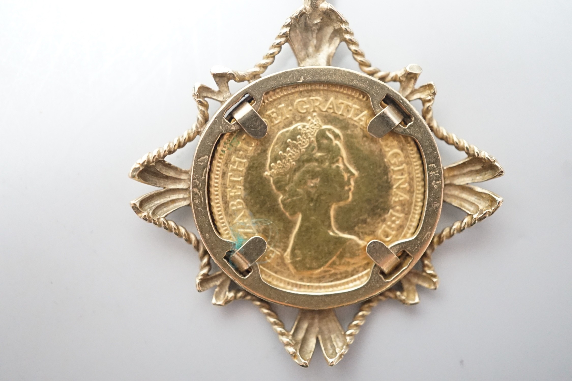 An Elizabeth II 1982 gold half sovereign, in 9ct gold pendant mount, 7.7 grams.